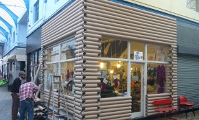 Circus log cabin shop in Brixton made from cardboard